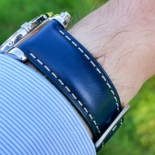 Wrist shot of the Oxford blue full grain leather apple watch strap. Placed on a males wrist.