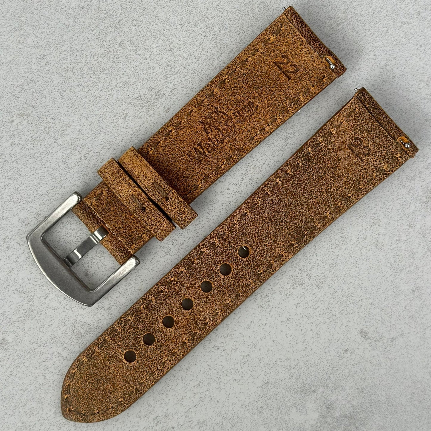 Rear of the Athens desert sand full grain leather watch strap. Watch And Strap logo. Quick release pins.
