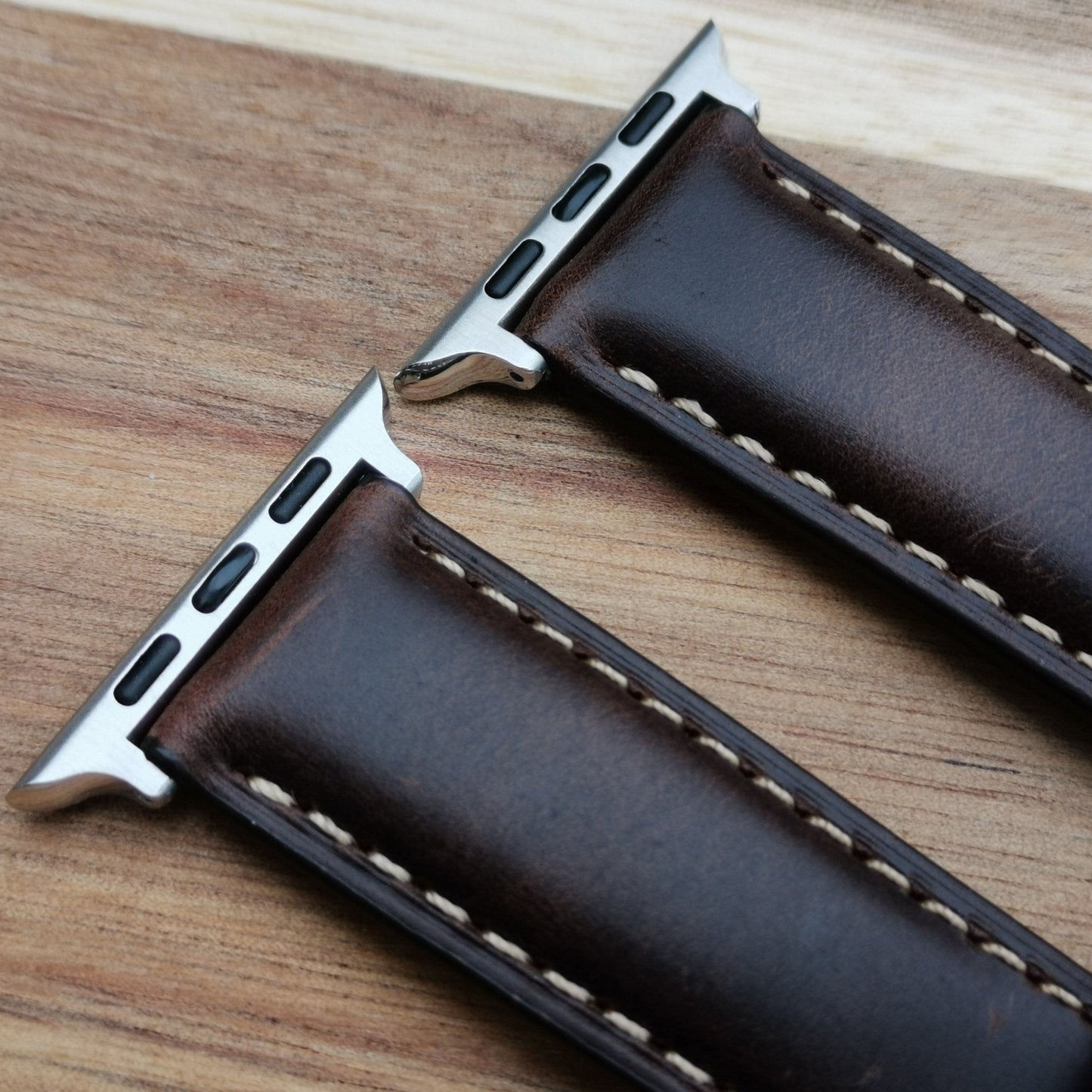 Top of the Oslo brown full grain leather apple watch strap. With handstitched contrast ivory stitching.