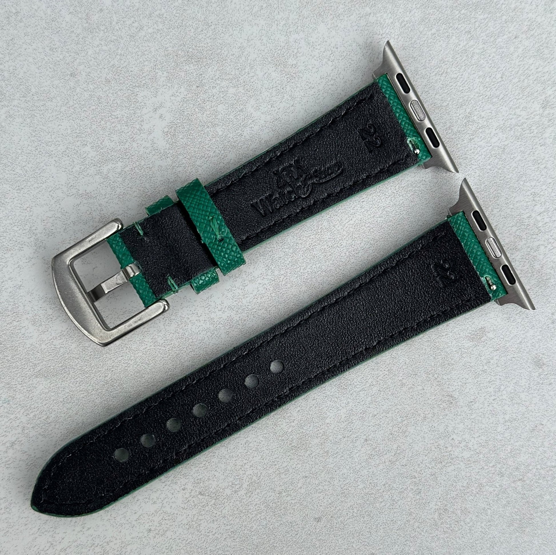 Rear of the Florence Emerald Green Saffiano Leather Apple Watch Strap. Black full grain leather back. Watch And Strap logo.