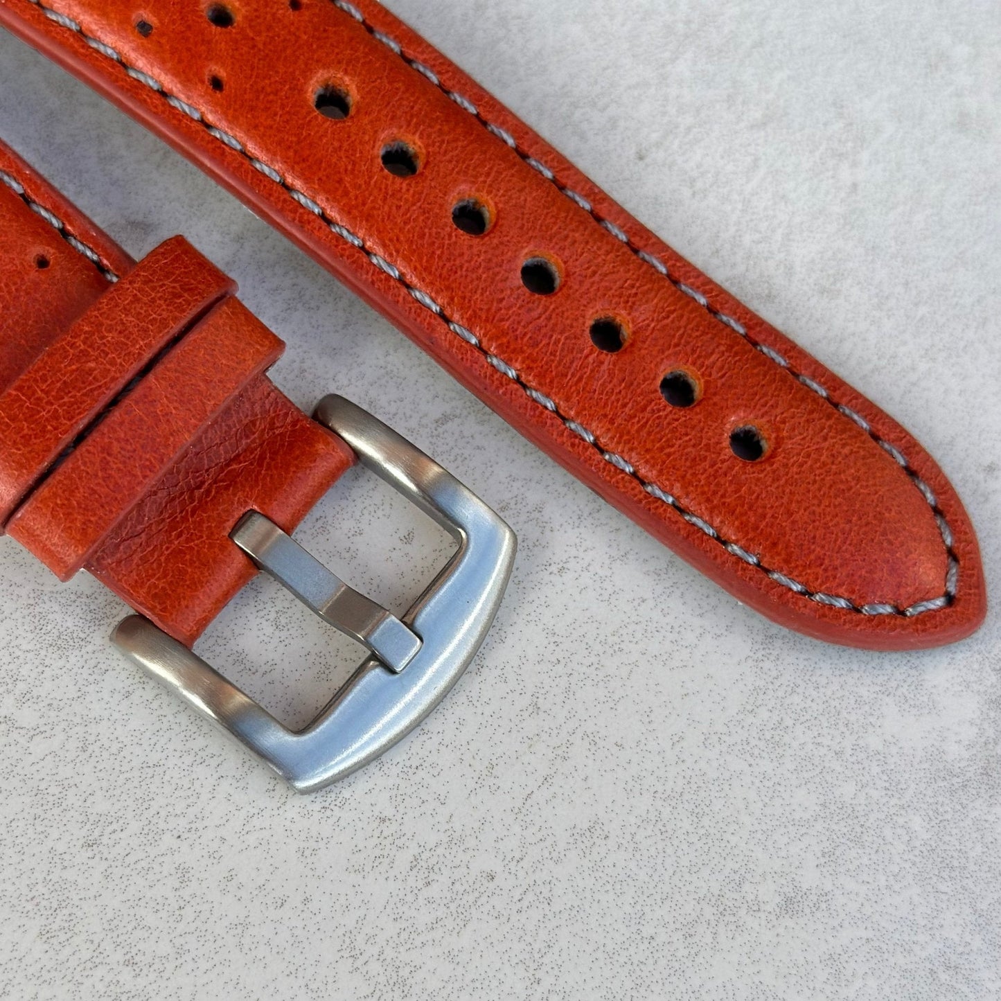 Brushed 316L stainless steel buckle on the Montecarlo orange full grain leather Apple Watch strap. Watch And Strap
