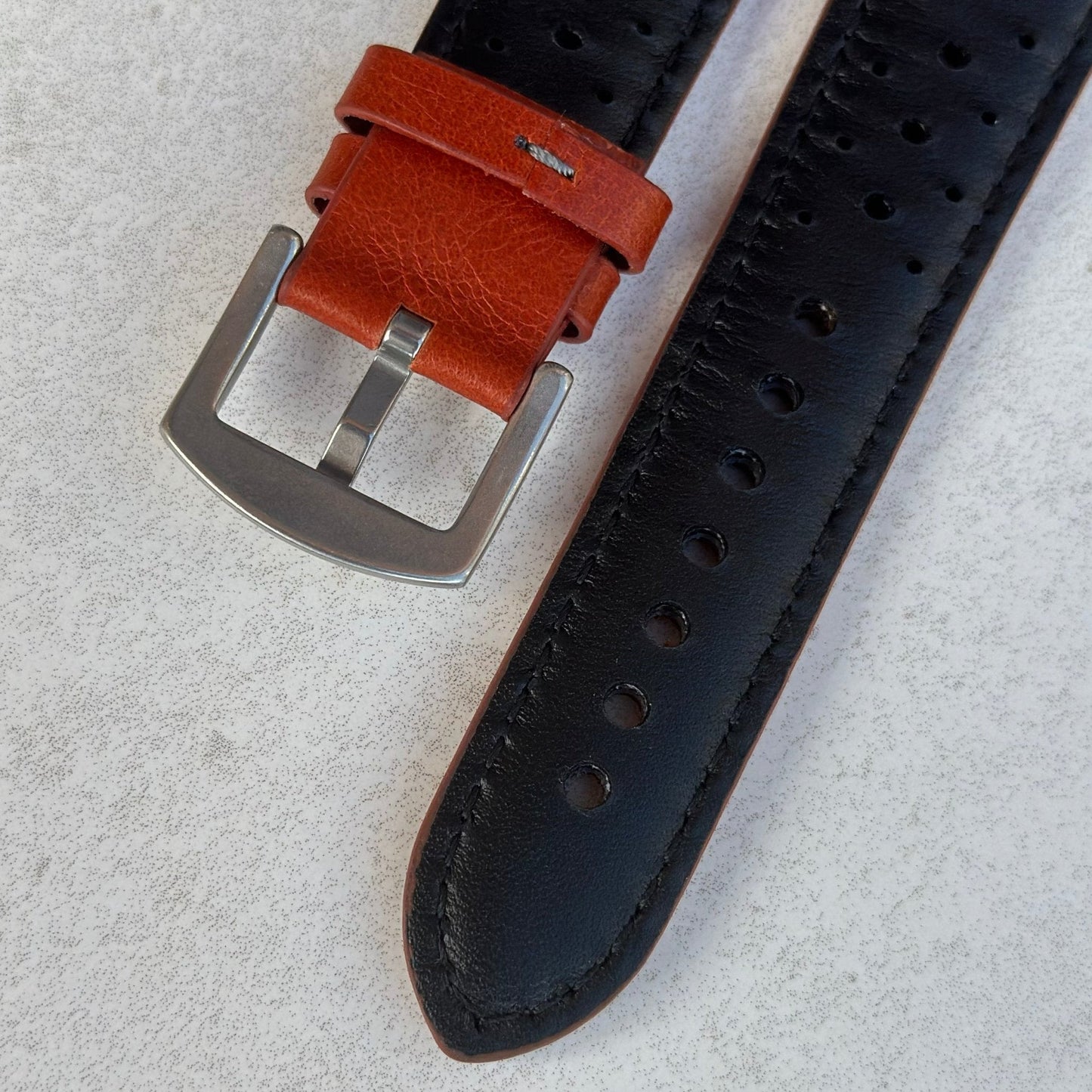 Underside of the buckle on the Montecarlo orange full grain leather Apple Watch strap. Watch And Strap