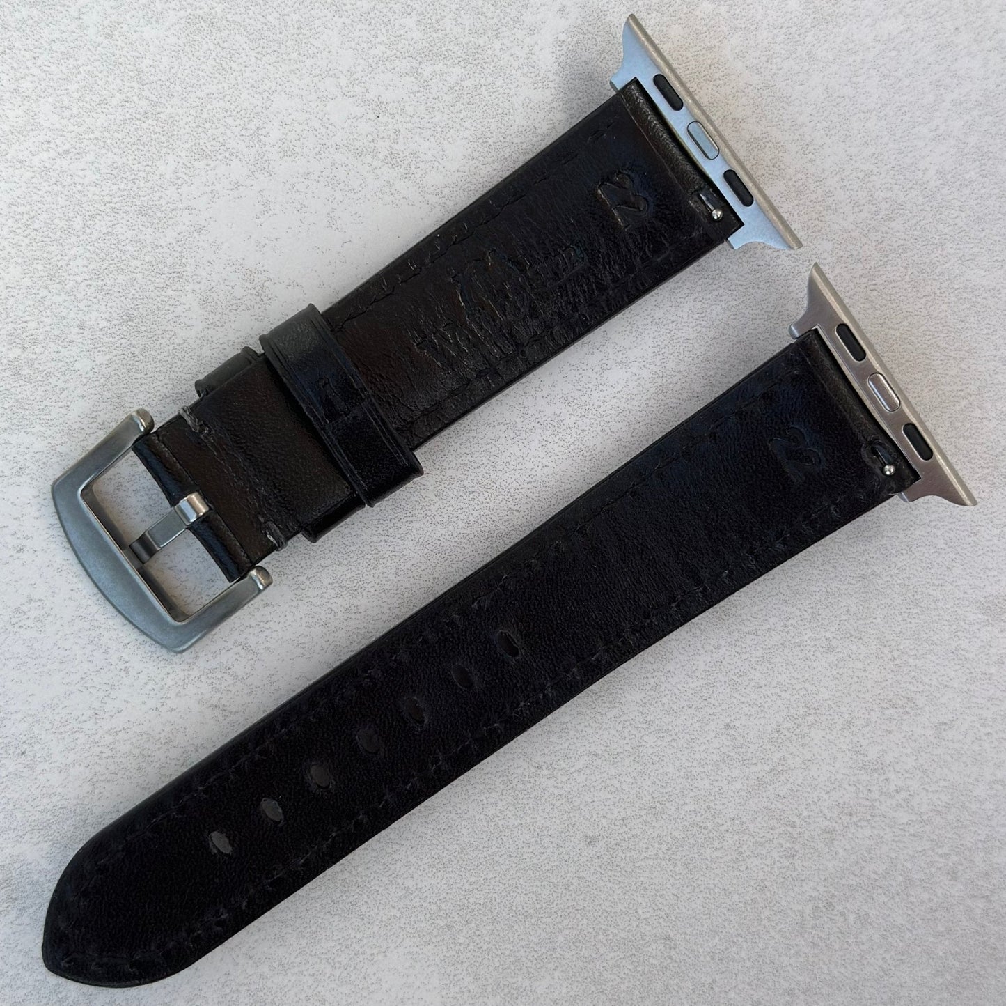Rear of the Prague jet black vegetable tanned leather watch strap. Watch And Strap logo.