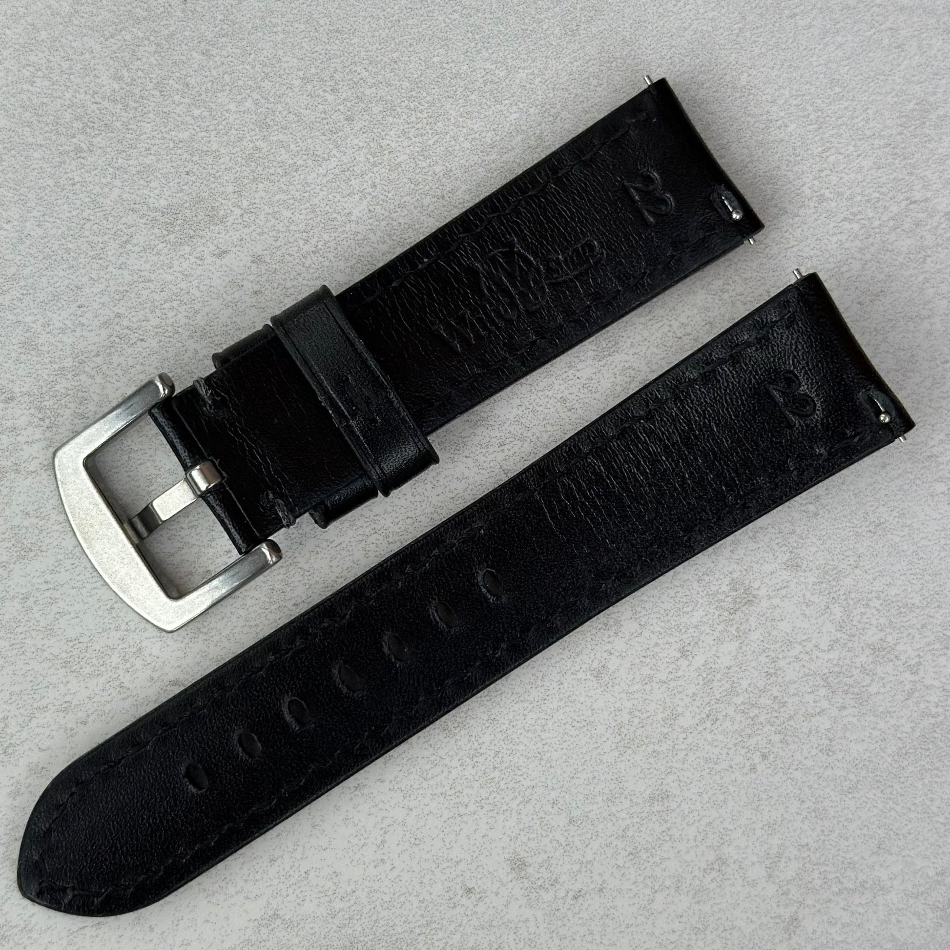 Rear of the Prague jet black vegetable tanned leather watch strap. Quick release pins. Watch And Strap logo.