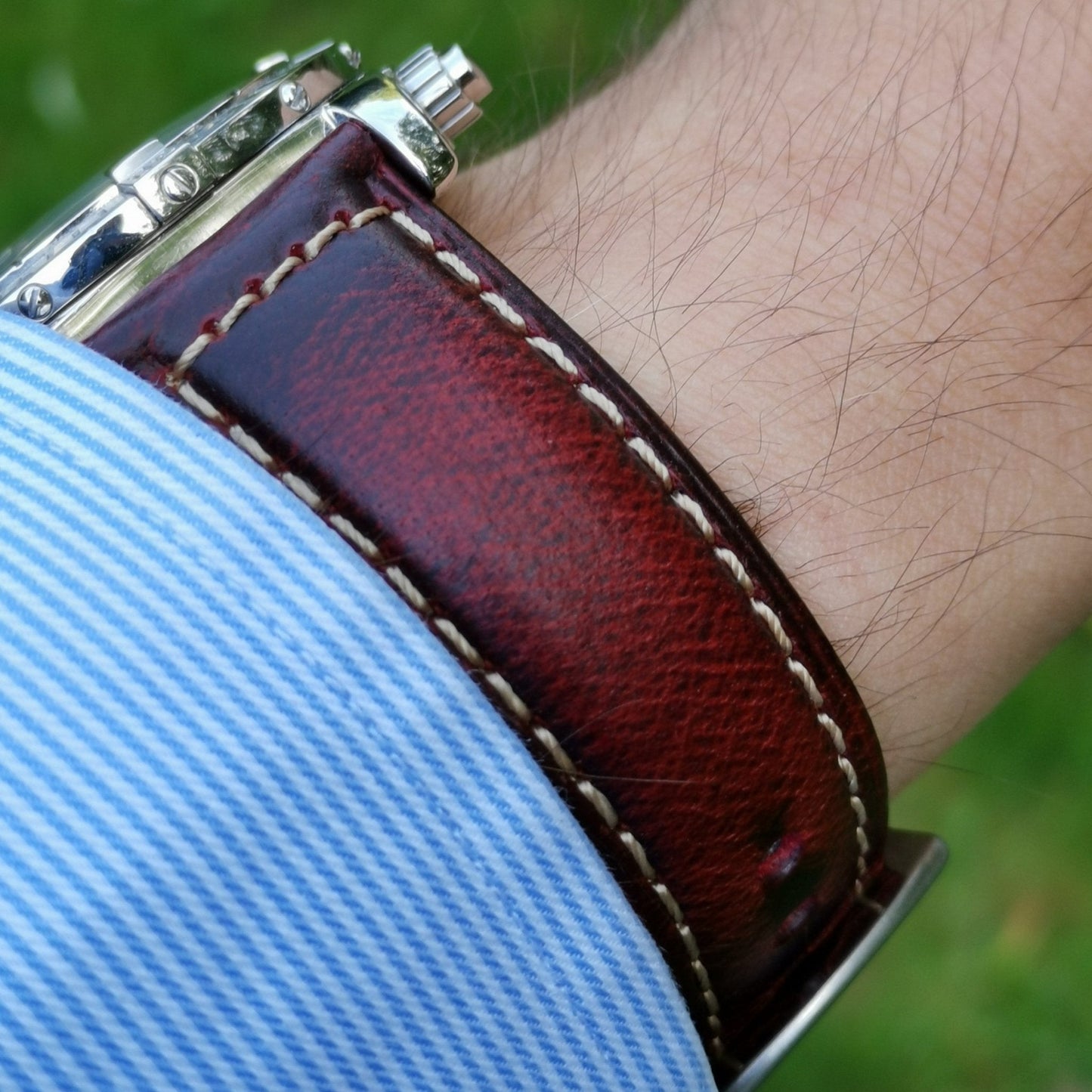 Wrist shot of the Berlin burgundy leather watch strap. Burgundy full grain leather with vibrant red streak. Watch And Strap